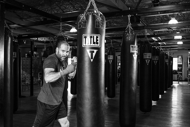 boxing movement education instructor demonstrating stance in modern Irish gym